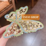 Pinza con forma de mariposa con perlas